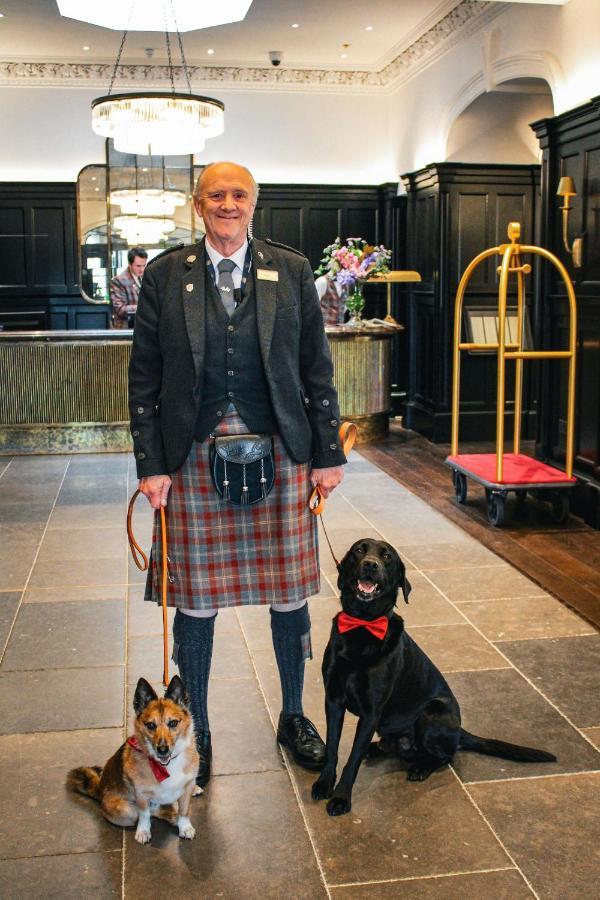 Cameron House On Loch Lomond Алекзандрия Экстерьер фото A Scottish hotel porter in traditional uniform